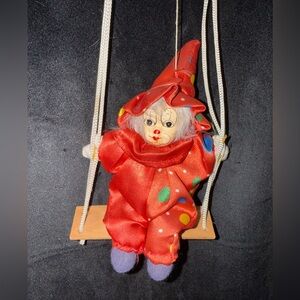 Colorful Clown Doll on Swing